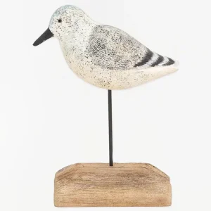 Pájaro de madera en tonos blancos, negros y grises