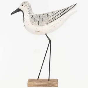 Pájaro de madera en tonos blancos, negros y grises